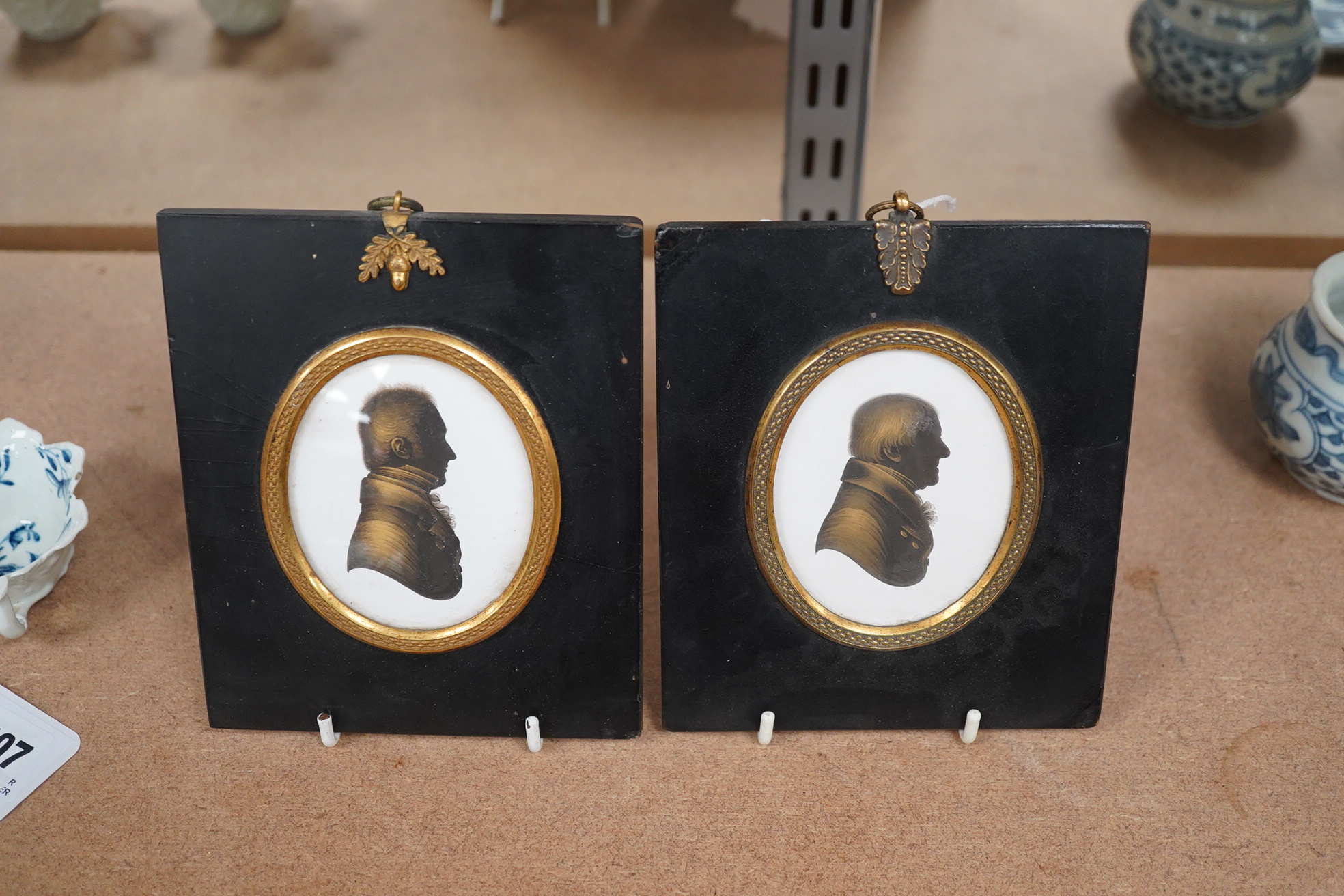 Miers & Field, two bronzed painted plaster silhouettes of gentlemen, framed. Condition - good